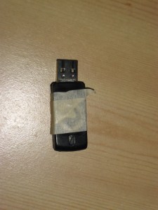 My old flash drive in its last moments. In lieu of flowers, please send money to a charity of your choice (though I wouldn't mind if you supported my Buckeyethon fundraising efforts).