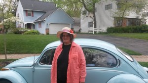 Pat Bertram with her famous blue 1972 Volkswagon.